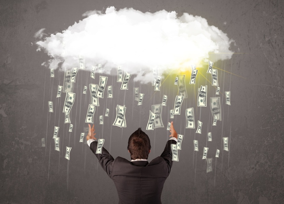 Image of a business owner underneath a cloud raining money after he increased is cash flow